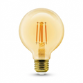 High-resolution hero shot of an LEDVANCE SMART+ WiFi Filament Amber G25 bulb on a pure white background.