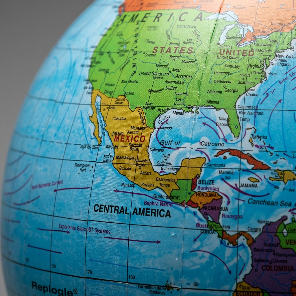 Macro photo focuses on clear printed details and textured surface of an inflatable globe.
