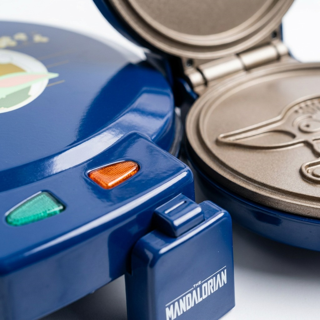 Close-up of the Star Wars Grogu Waffle Maker's non-stick interior plate and power indicator lights.