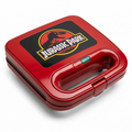 Uncanny Brands Jurassic Park Grilled Cheese Maker, red compact panini press with T-Rex logo lid.