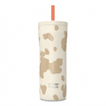 Contigo 24oz Streeterville 2.0 Tumbler in Oatmilk cow print with an orange straw on white.