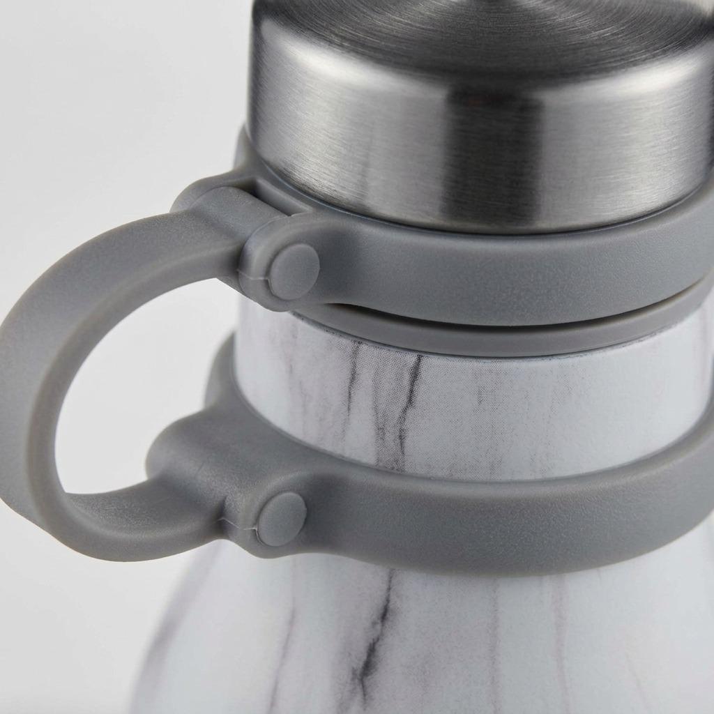 Close-up of Contigo Matterhorn water bottle showing marble finish, steel cap, and grey carry loop.