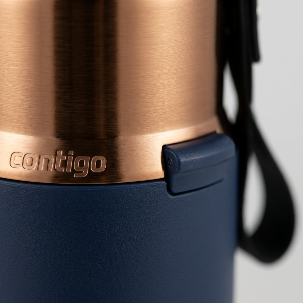 Macro detail of the Contigo Snapseal PVD mug in Abyss Blue showing the metallic finish and logo.