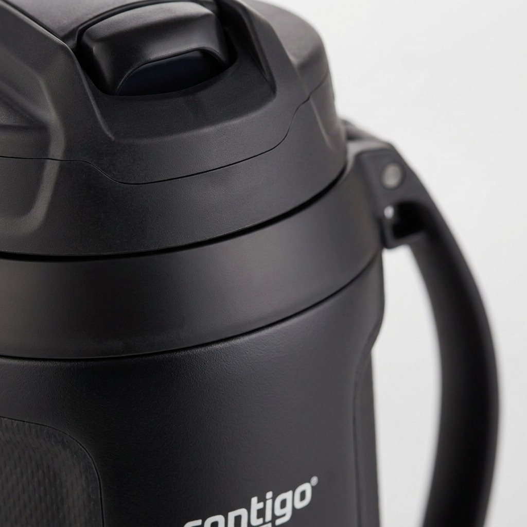 Macro detail of the Contigo 64 oz Fit Autospout Jug lid, showing the matte black lid and button.