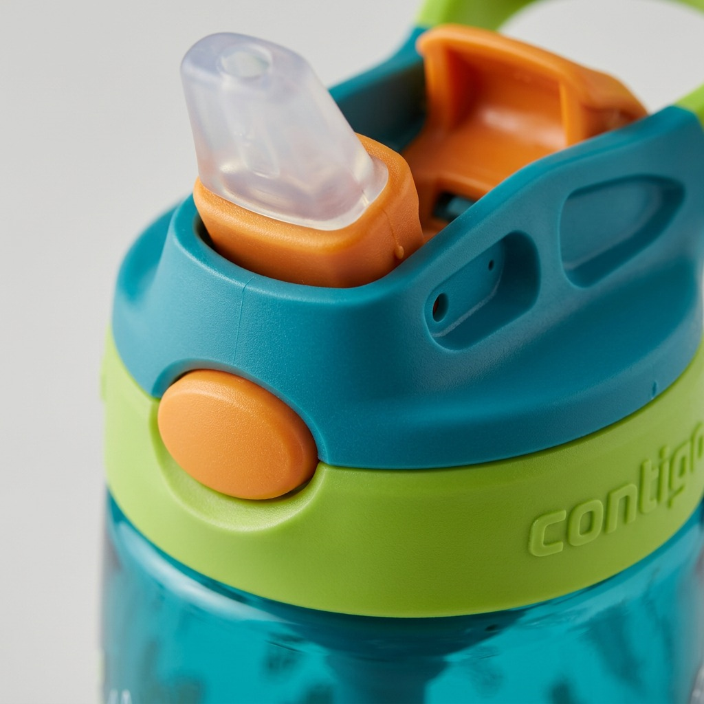 Macro detail of a Contigo Kids Autospout bottle lid featuring the pop-up straw and push button.