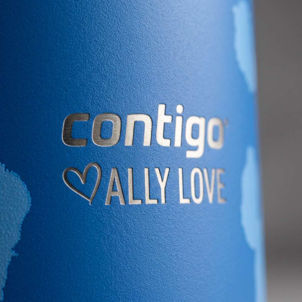 Macro view of the brushed steel Contigo x Ally Love logo etched onto a blue powder-coated tumbler.